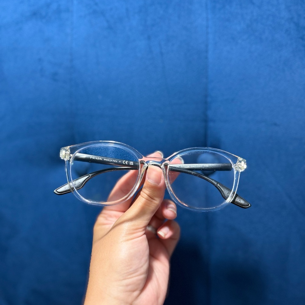 Prada Transparent Frame Eyewear with Black Temples